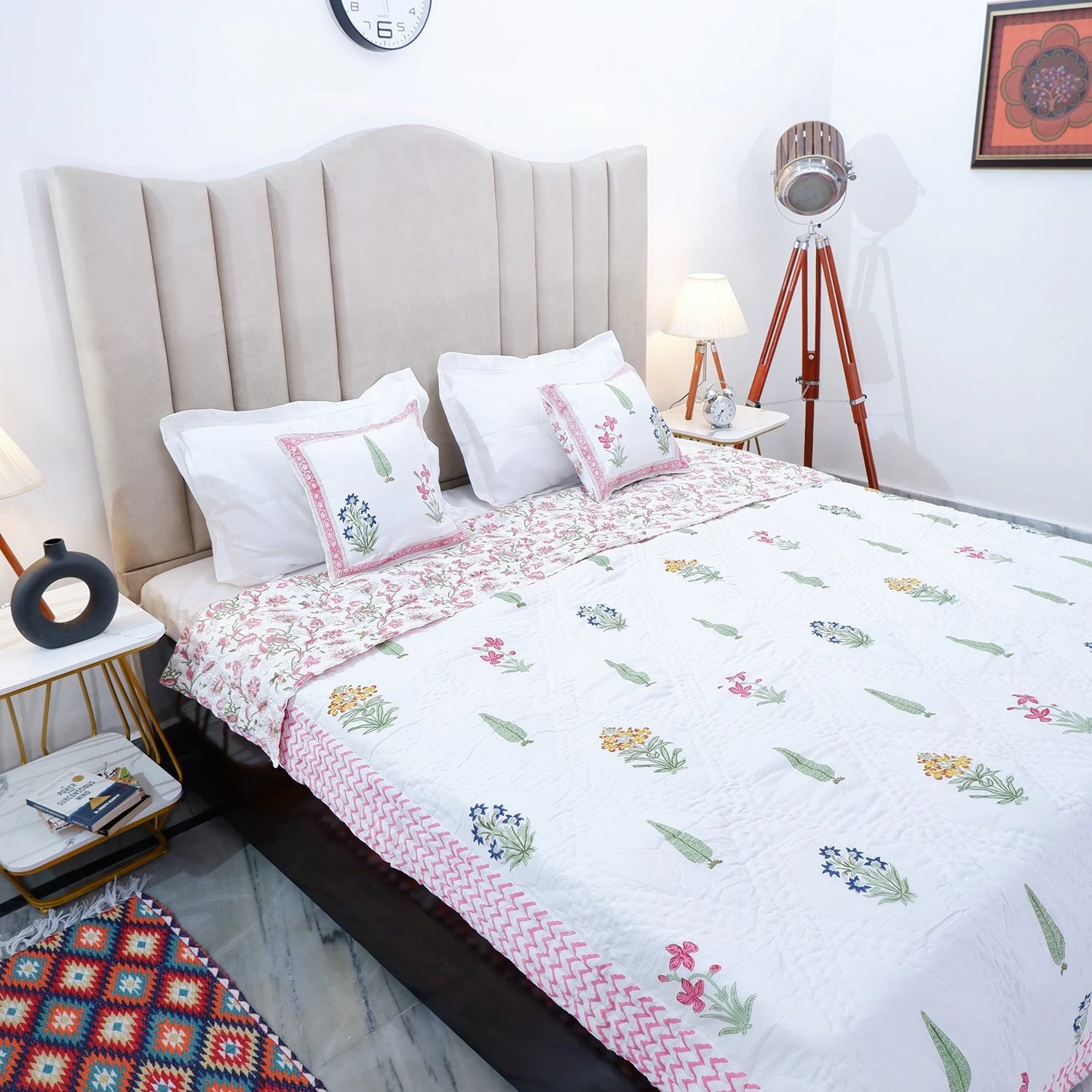 Jaipuri block print quilt set featuring colorful floral patterns on a white background for stylish bedding